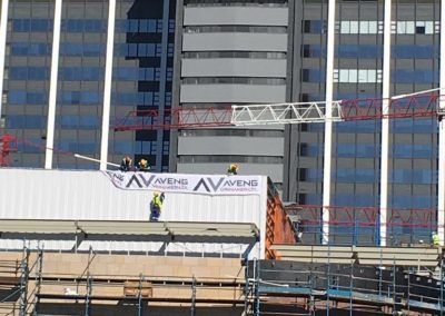 High pressure jetting of mesh panels, aluminium toot structures and windowpanes at the Media 24 Centre.